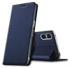 A dark blue flip case for a smartphone is shown, with the phone partially inserted and its rear camera visible. Produktbild-Vorschau