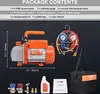 A flat lay image showing a vacuum pump kit, including the pump, manifold gauge, hoses, adapters, oil, toolkit bag, and manual, laid out against a dark background. Náhľad obrázku produktu