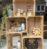 A display of various eco-friendly cleaning products and wooden crates in a shop window. Náhled obrázku produktu