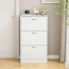 A white shoe cabinet with three drawers is shown in a hallway next to a white door. Náhľad obrázku produktu
