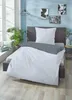 A bedroom scene with a bed made up with bedding, a plant, and decorative items. Produktbild-Vorschau