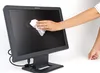A hand is cleaning a computer monitor with a white wipe. Náhled obrázku produktu