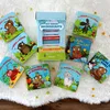 A collection of children's books arranged around a central box. Produktbild-Vorschau