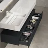 A modern bathroom vanity with a sink and organized drawers. Produktbild-Vorschau