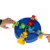Hands playing a board game with colorful hippos and balls. Náhled obrázku produktu