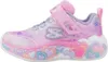 A side view of a single child's sneaker. Voir les images du produit