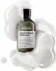 A bottle of L'Oréal Professionnel Absolut Repair Molecular shampoo surrounded by foam and liquid. Produktbild-Vorschau
