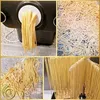 A collage of images showing the process of making pasta, from extrusion to drying. Produktbild-Vorschau
