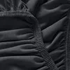 A close-up view of dark gray fabric with elastic gathering. Produktbild-Vorschau