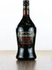 A bottle of Kirsberry Cherry Speciality liqueur on a wooden surface. Produktbild-Vorschau