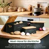 Kitchen counter with storage boxes for potatoes, onions, and garlic. Produktbild-Vorschau