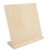 A wooden earring display stand with multiple holes for organizing earrings. Produktbild-Vorschau
