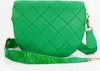 A green quilted handbag with a patterned strap. Anteprima dell’immagine prodotto