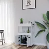 A white bar cart with bottles and glasses on shelves, placed in a room with a plant and a window with curtains. Podgląd zdjęcia produktu