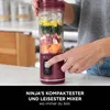 A person is using a Ninja blender to make a smoothie. Podgląd zdjęcia produktu