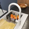 A modern kitchen sink with a white faucet and a basket of oranges. Produktbild-Vorschau
