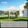 A white gazebo set up on a green lawn in a backyard with chairs and a table. Produktbild-Vorschau