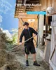 A man is working in a barn with hay, and a security camera is mounted on the wall. Náhled obrázku produktu
