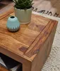 A close-up of a wooden side table with a potted plant and a small vase. Produktbild-Vorschau