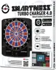 The image shows the packaging of a Smartness Turbo Charger 4.0 electronic dartboard, along with a tablet displaying the dartboard's app interface. Produktbild-Vorschau