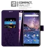 A purple wallet-style phone case with card slots and a phone inserted, displaying a landscape wallpaper. Náhled obrázku produktu