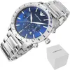 A close-up studio shot of an Emporio Armani watch with a blue dial and silver stainless steel band, placed next to its white branded box. Náhľad obrázku produktu