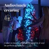 People dancing around a Christmas tree decorated with colorful lights. Náhled obrázku produktu