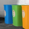 Three recycling bins in different colors (blue, green, orange) are lined up. Produktbild-Vorschau