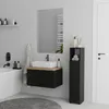 A modern bathroom with a black vanity, white sink, and a tall black cabinet. Náhled obrázku produktu