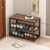 A shoe cabinet with a wooden top, placed in a hallway next to a door and a wall with vertical stripes. Shoes are neatly arranged on the shelves. Produktbild-Vorschau