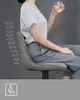 A woman sitting on a chair, holding a glass of water. There are graphic elements on the left side of the image and an icon at the bottom. Náhled obrázku produktu
