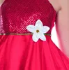 Close-up of a red dress with sequins and a white flower. Produktbild-Vorschau