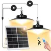 A solar panel and two pendant lights are displayed, with a remote control and icons indicating motion detection. Náhled obrázku produktu