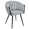 A light gray armchair with a braided design on a white background. Produktbild-Vorschau