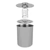 A disassembled stainless steel meat cooker with a pot, a lid with a spring mechanism, and a separate lid. Produktbild-Vorschau