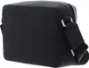 A black leather crossbody bag is shown from a side angle against a white background. Voir les images du produit