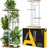 A product image showing a metal plant stand with wooden shelves, decorated with plants, and a product box. Produktbild-Vorschau