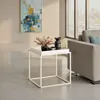 A modern living room scene with a side table and abstract art. Produktbild-Vorschau
