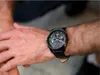 A close-up shot of a man's wrist wearing a Tommy Hilfiger watch. Produktbild-Vorschau