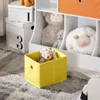 A children's storage unit with toys and storage boxes. Anteprima dell’immagine prodotto