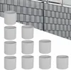 A group of cylindrical objects in front of a fence-like background. Produktbild-Vorschau