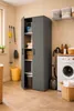 A laundry room with a storage cabinet, washing machine, and cleaning supplies. Anteprima dell’immagine prodotto