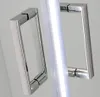Close-up of two chrome shower door handles and a clear shower door. Produktbild-Vorschau