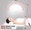A woman lying on a massage table under a pink half-moon LED lamp. Náhľad obrázku produktu