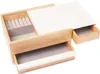 A jewelry box with multiple compartments and drawers, made of wood and white material, is shown against a white background. Voir les images du produit