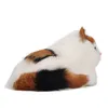 A plush toy cat lying on its side against a white background. Náhľad obrázku produktu