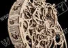 A close-up view of a wooden mechanical clock mechanism. Voir les images du produit