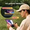 A person is using a drawing tablet outdoors. Produktbild-Vorschau