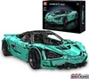 A teal colored toy sports car and its packaging. Produktbild-Vorschau