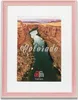 A framed picture of a canyon with the word Colorado written on it. Produktbild-Vorschau
